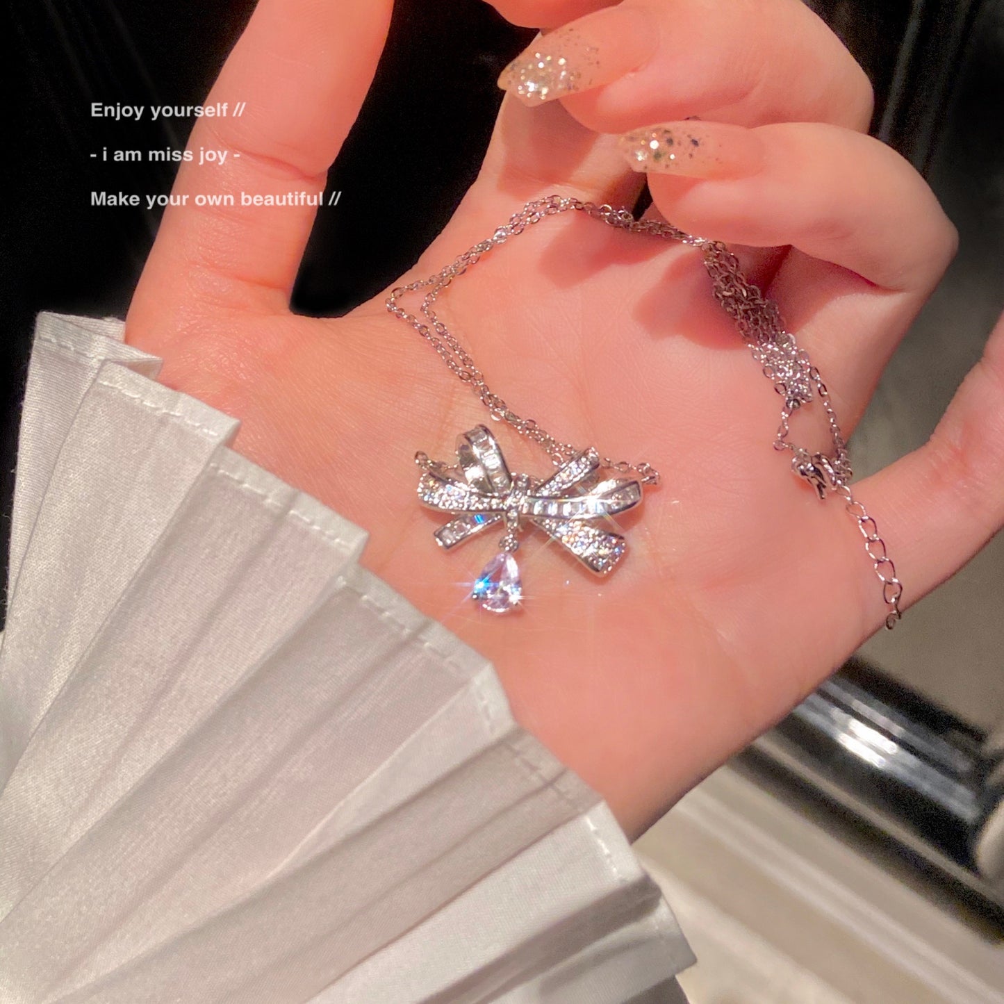 A diamond bow necklace